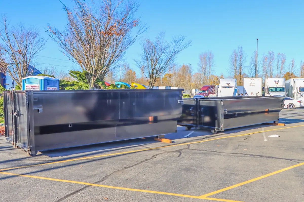 Professional dumpster rental service with roll-off container on residential driveway in Upper Macungie